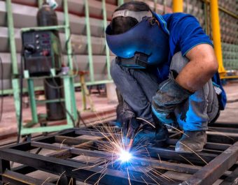 worker-with-protective-mask-welding-metal_73899-1135